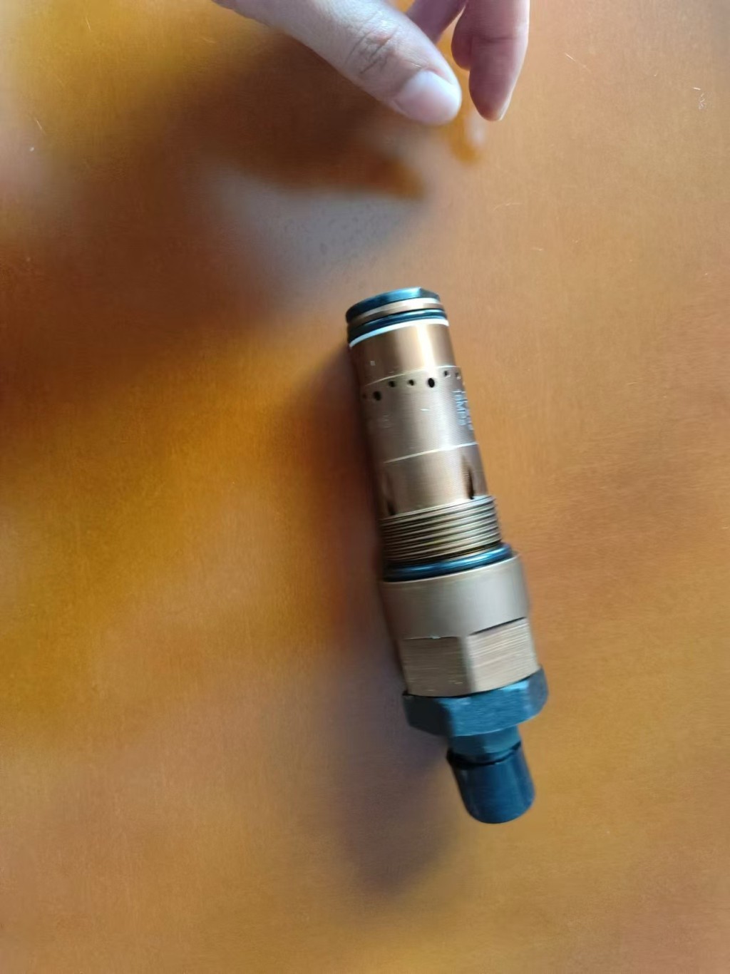 Loader mud relief valve