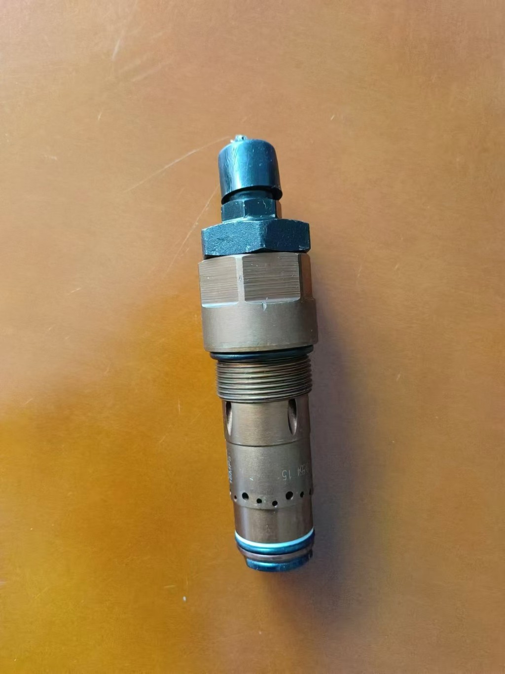 Loader mud relief valve